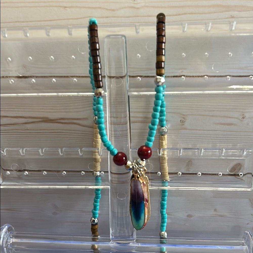 Othr Blue and Brown Beaded Necklace with Feather Pendant